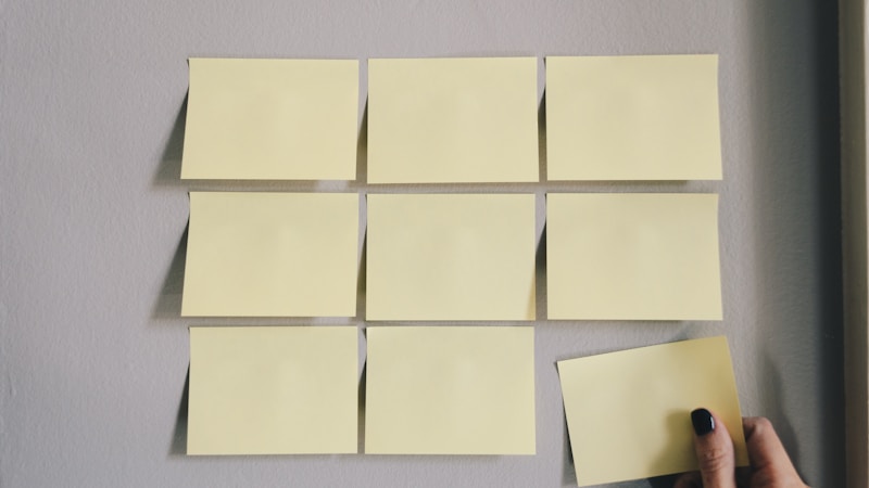 Sticky notes and task cards on a project board